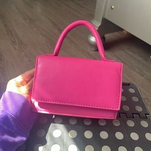 pink small hand bag or cross body! comes with long straps